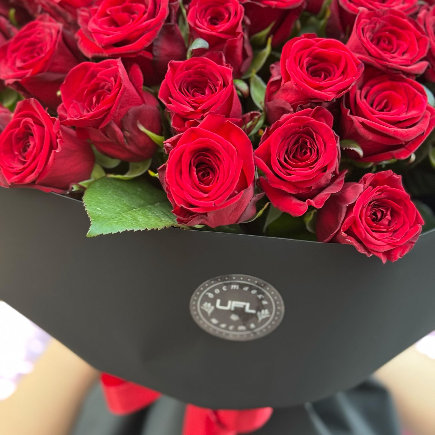 Bouquet 51 red roses in black wrapping