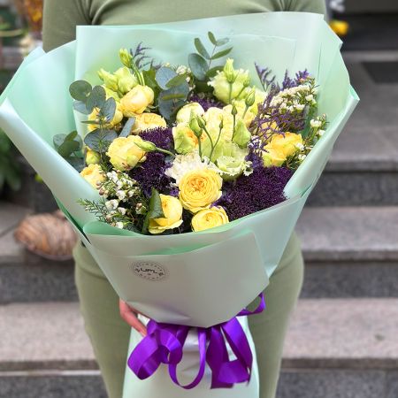 yellow rose, peony bubbles (6 pcs.), light green eustoma, purple trachelium, limonium, white chamelacium, packaging, ribbon